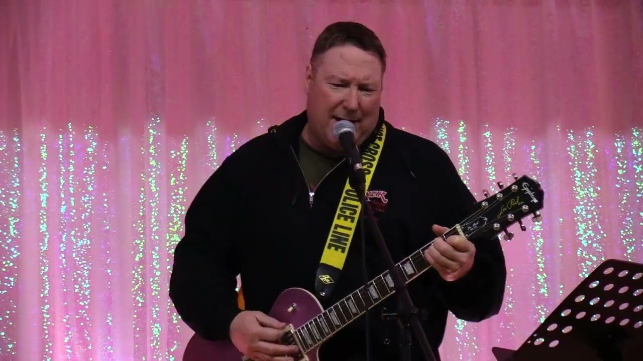 Band performing (Driving my life away)