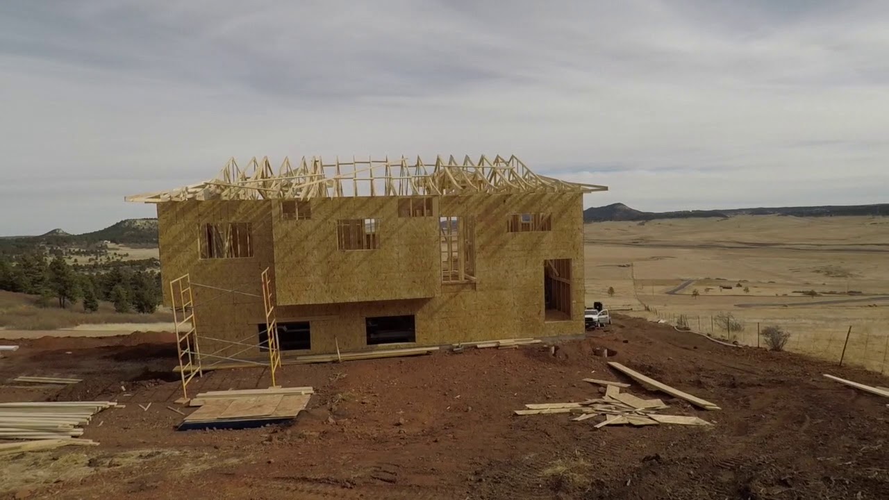 Winding driveway to mountain retreat during framing.