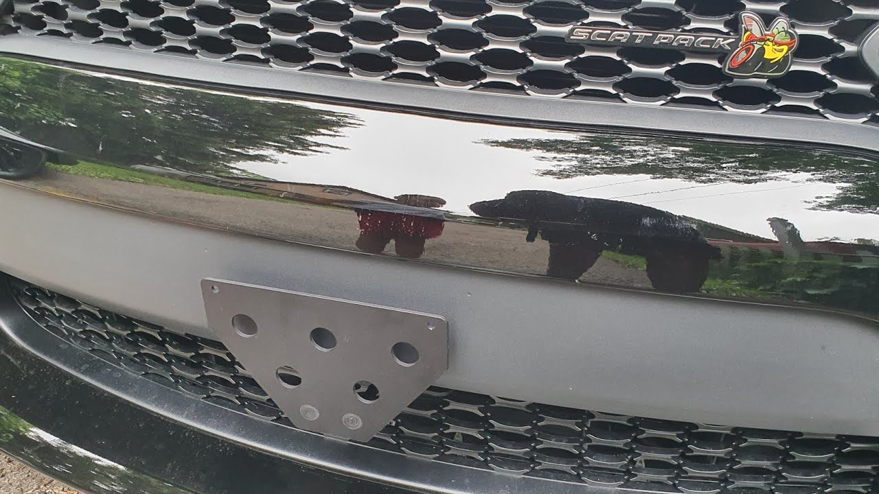Installing the sto n sho no show license plate frame on the scat pack 2020