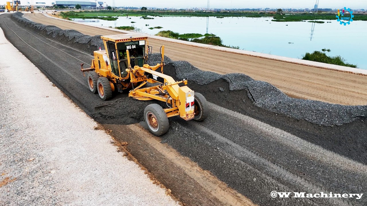 Best Mixing Action CAT Grader Spreading Gravel Installing Foundation New Roads Across Deep Water
