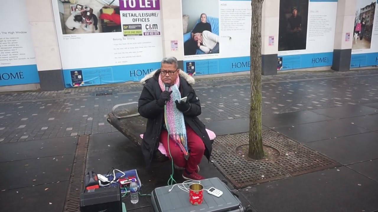 Alex Cruz sings Solitaire by the Carpenters in Williamson Square Liverpool