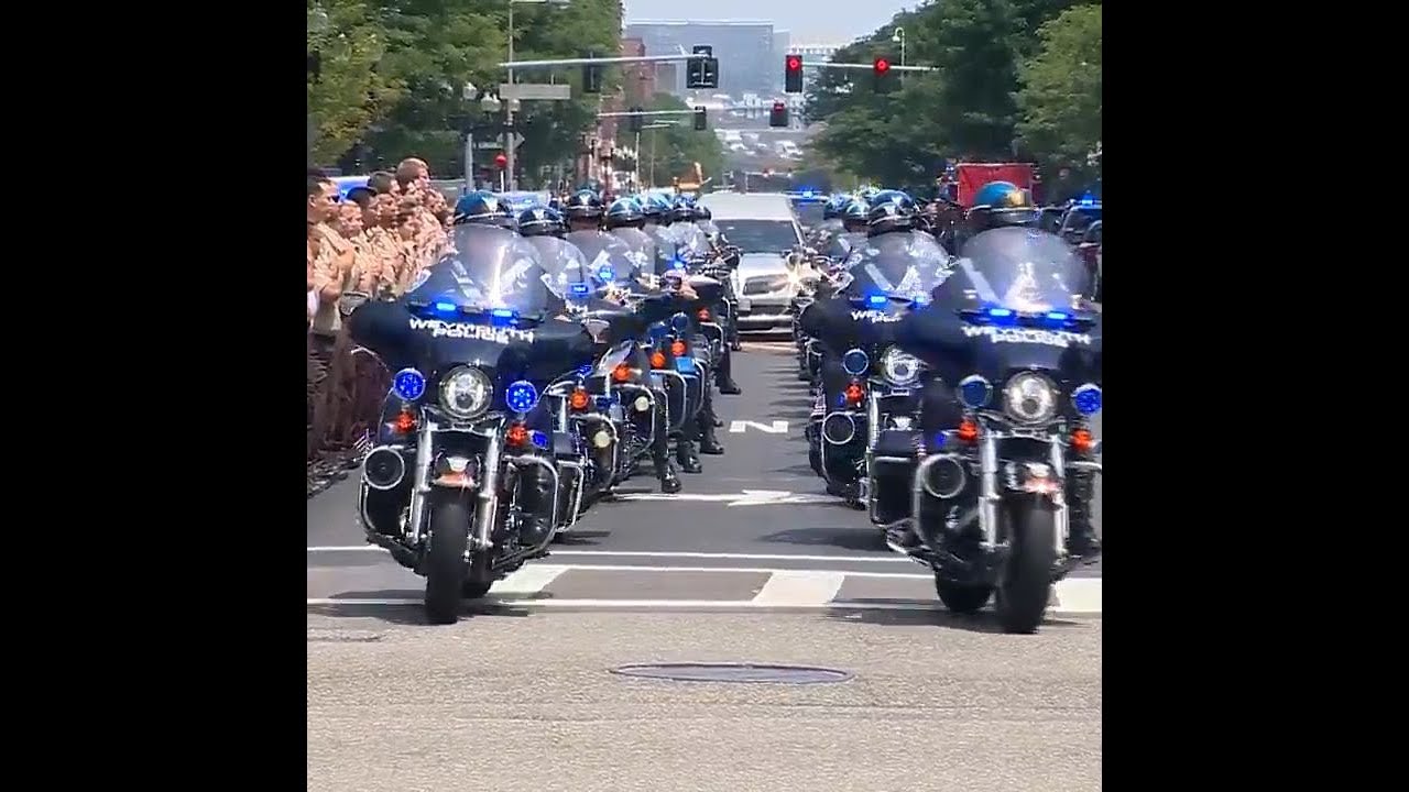 Procession brings fallen officer to funeral home