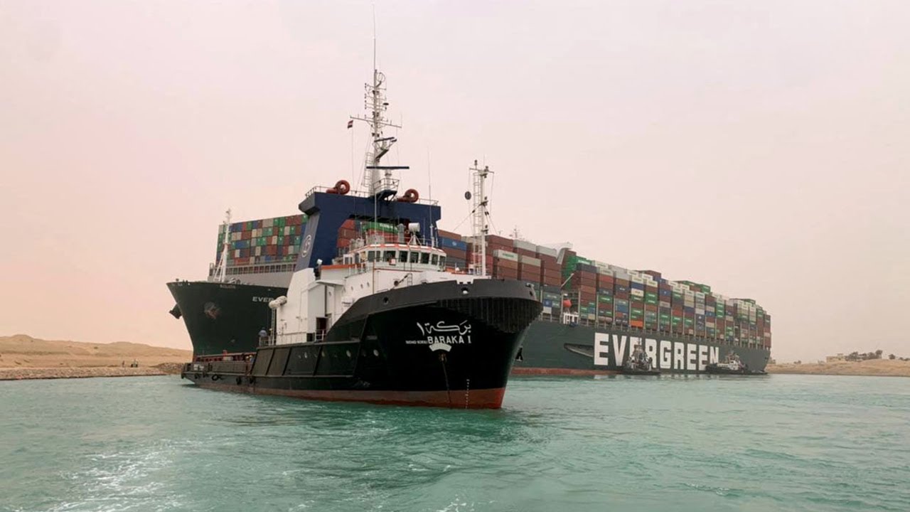 Suez Canal: Tugboats try to free huge container ship run aground causing standstill traffic