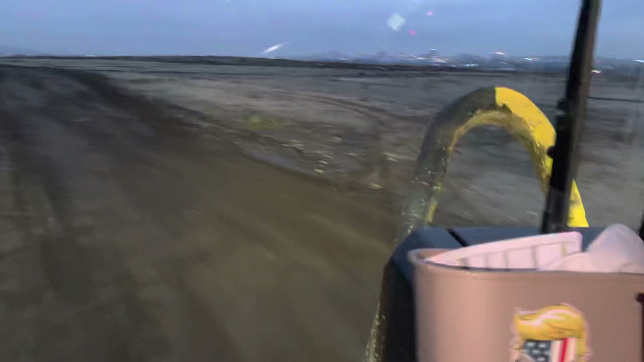 Cat 657G hauling asphalt grinds ￼