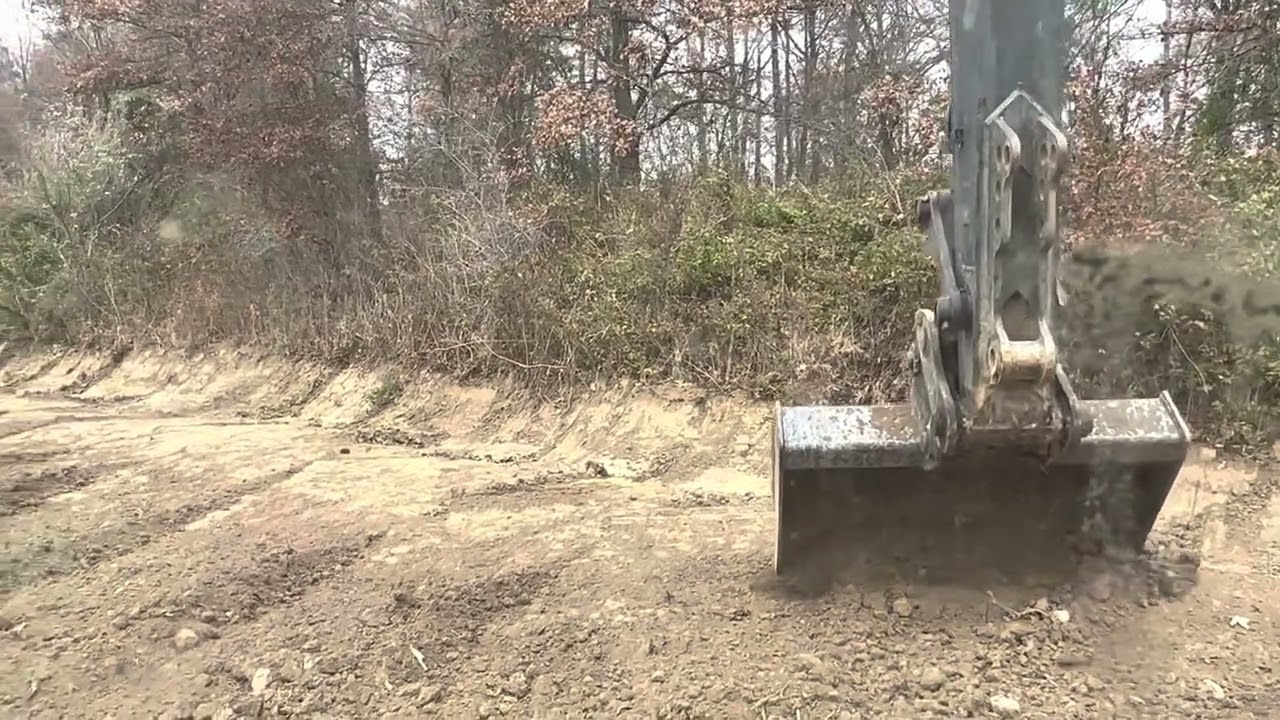 Excavator work with clean out bucket