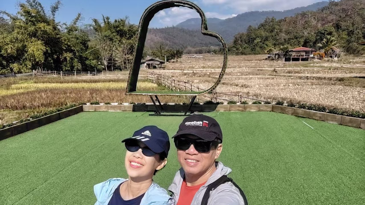 Walking the Kho Ku So Bamboo Bridge, beautiful flora, open fields, and the calm rhythm of rural Pai.