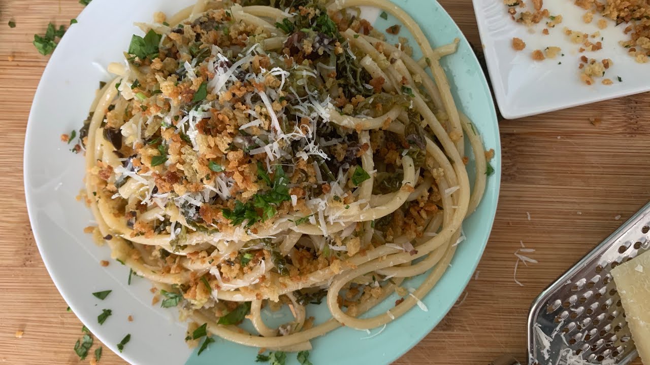Bucatini pasta with capers olives and shredded cabbage