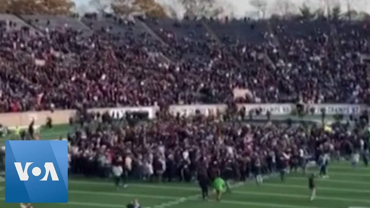 Climate Change Protesters Take to Field During Halftime of Yale, Harvard Football Game