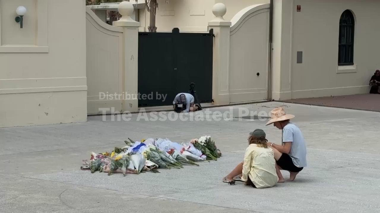 Sydney residents leave flower tributes at scene of deadly shooting on Bondi Beach