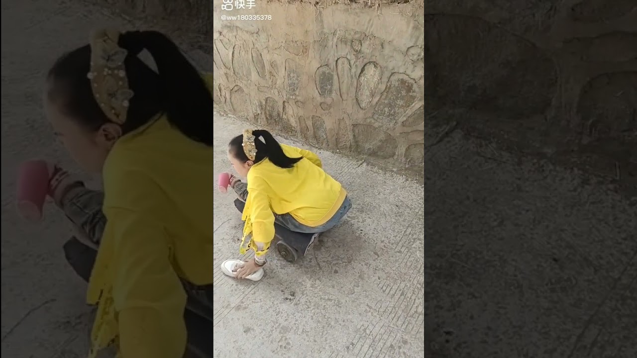 Paralyzed girl riding her cart.