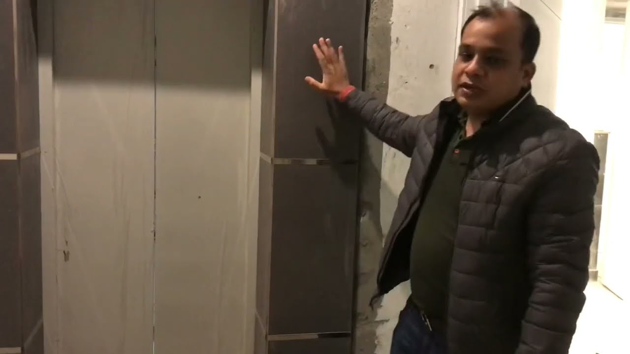 Tile wall cladding around the Lift