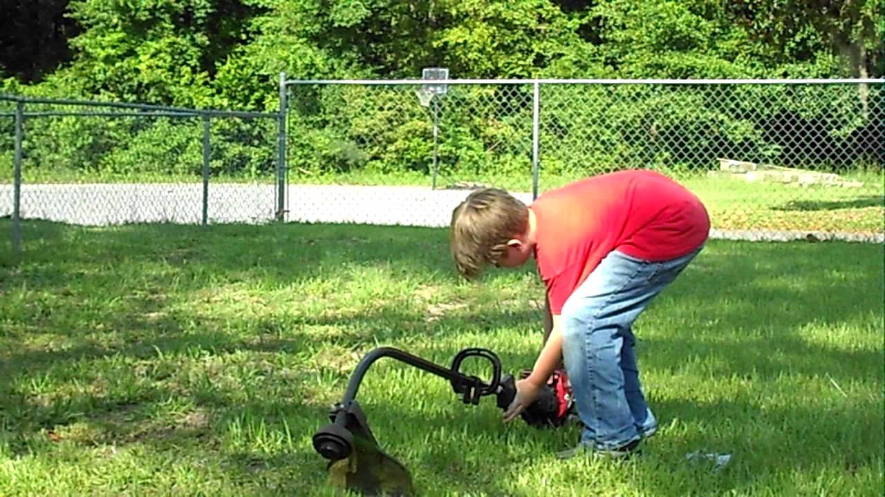 8 Year Old Wilson Hulett Demonstrates Gas String Trimmer