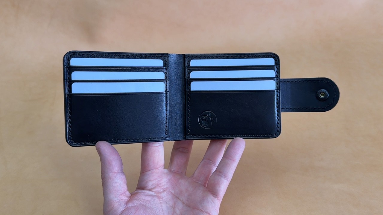 Classic bi-fold wallet made of vegetable-tanned leather that I made to order