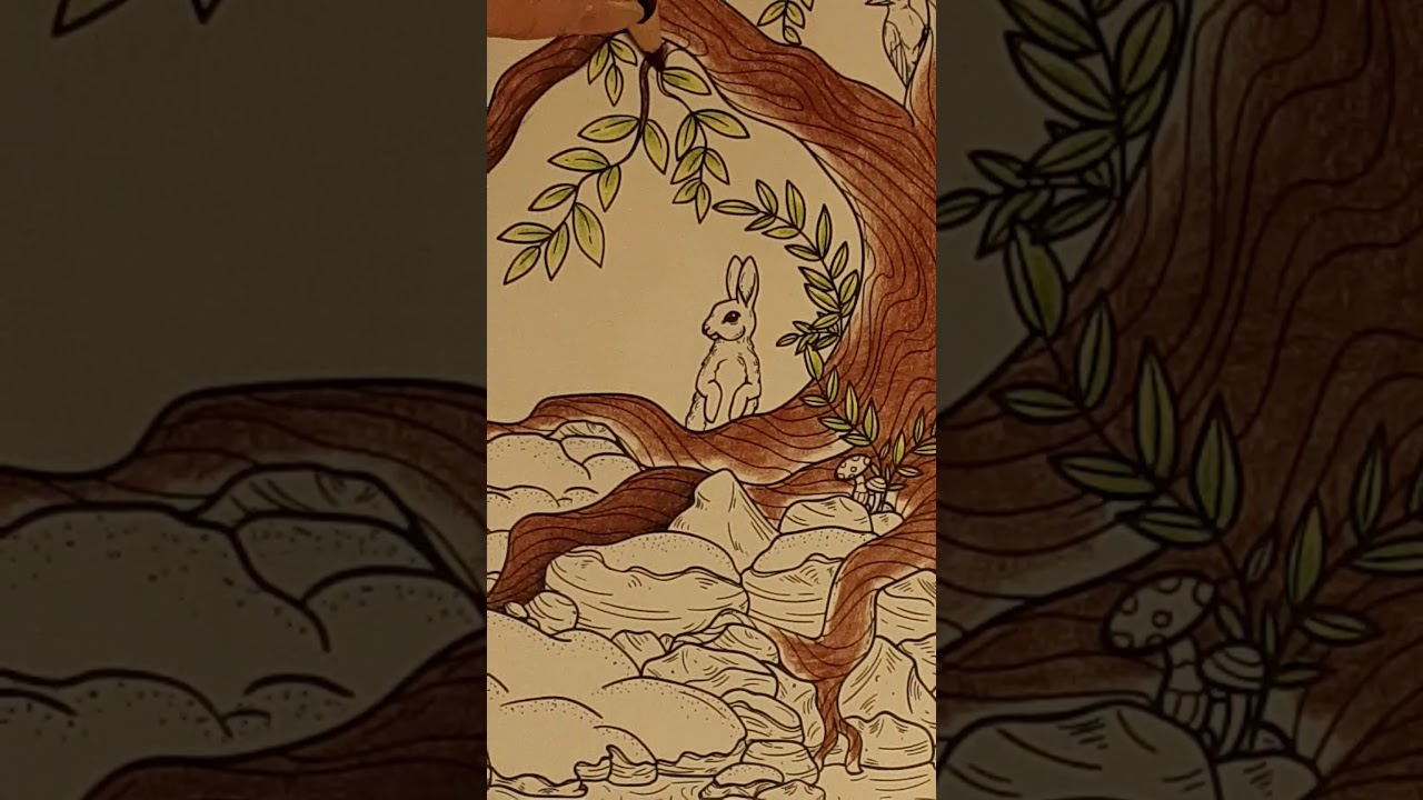 Indescribable coloring book, Arteza pencils, and a tree trunk