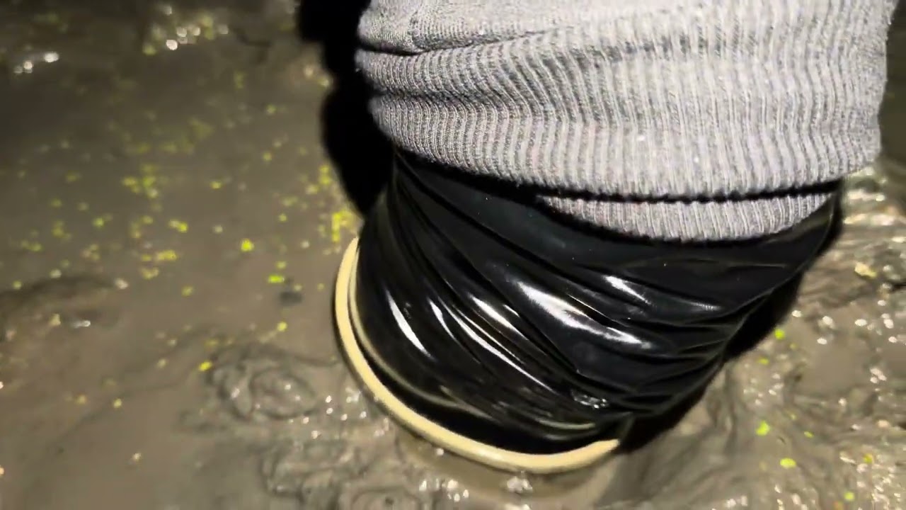 Ribbon rain boots in mud