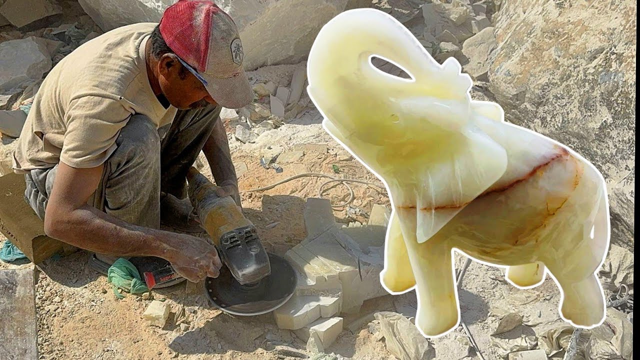 Carving Ancient Elephant in White Marble