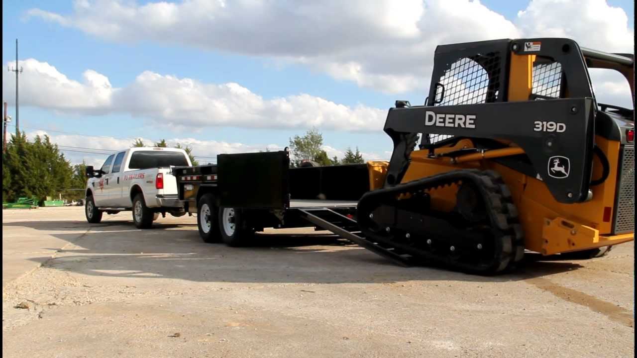 Loading a Skid Steer in a PJ 83