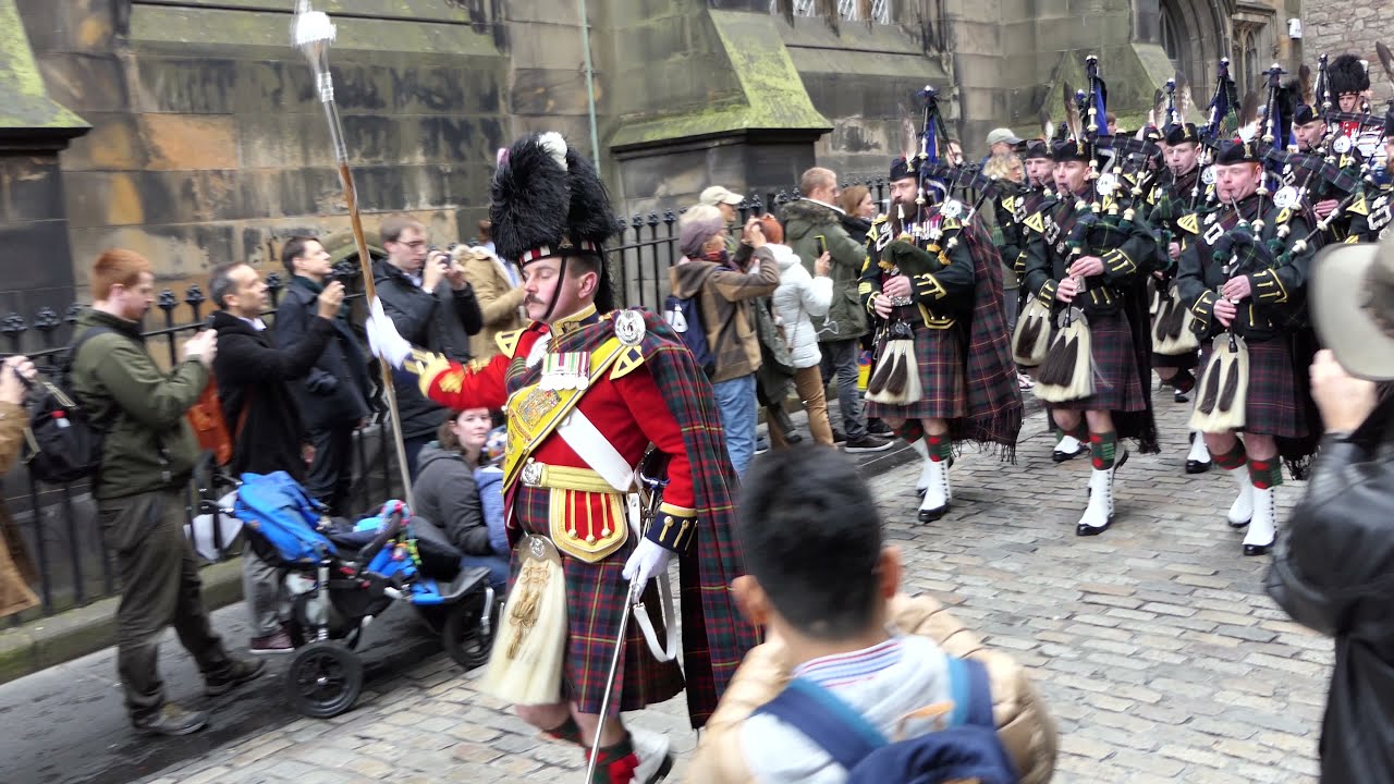 Pipers proudy parade the polished cobbles of Edinburgh's Royal Mile