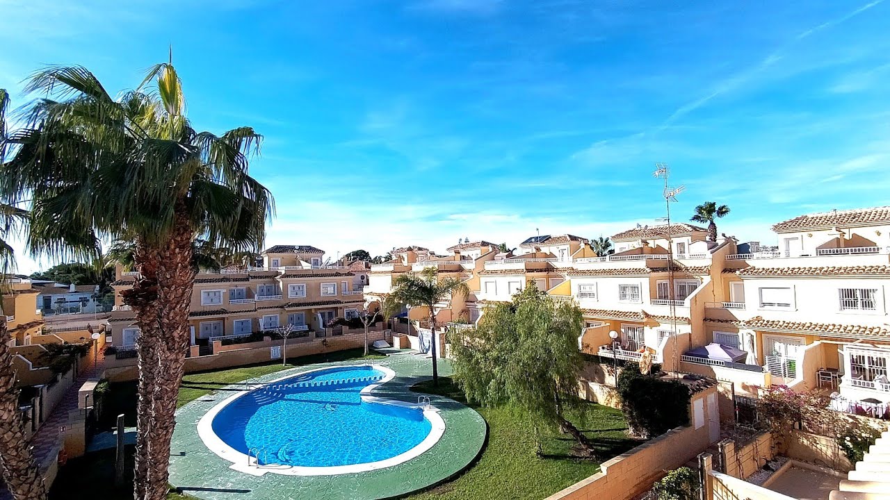  Punta Prima 3 bed 2 bath south facing villa over looking pool, gated community, driveway.