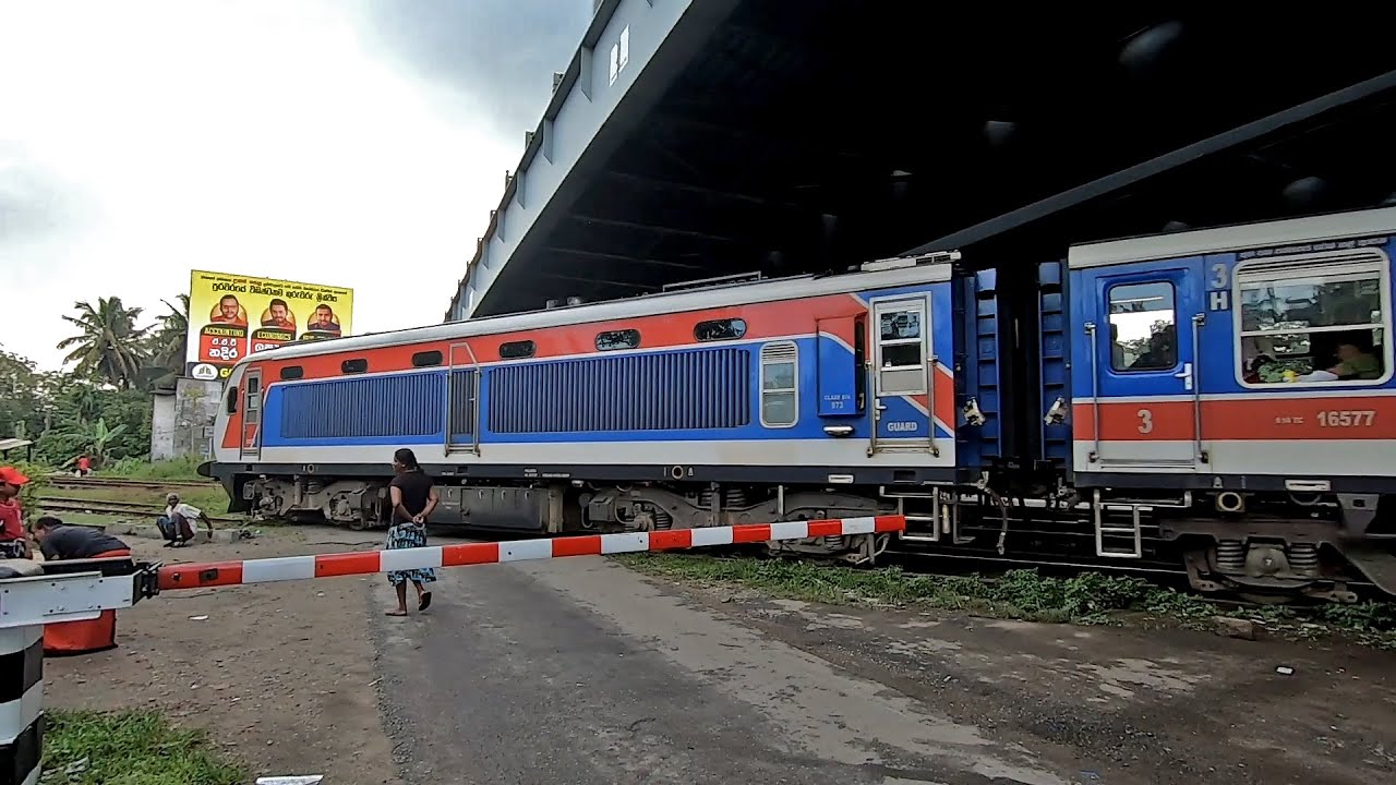 Udarata Menike S14 DMU Level Crossing near Kelaniya Railway Station in Sri Lanka