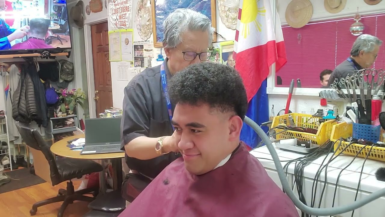 Short, low tapered haircut