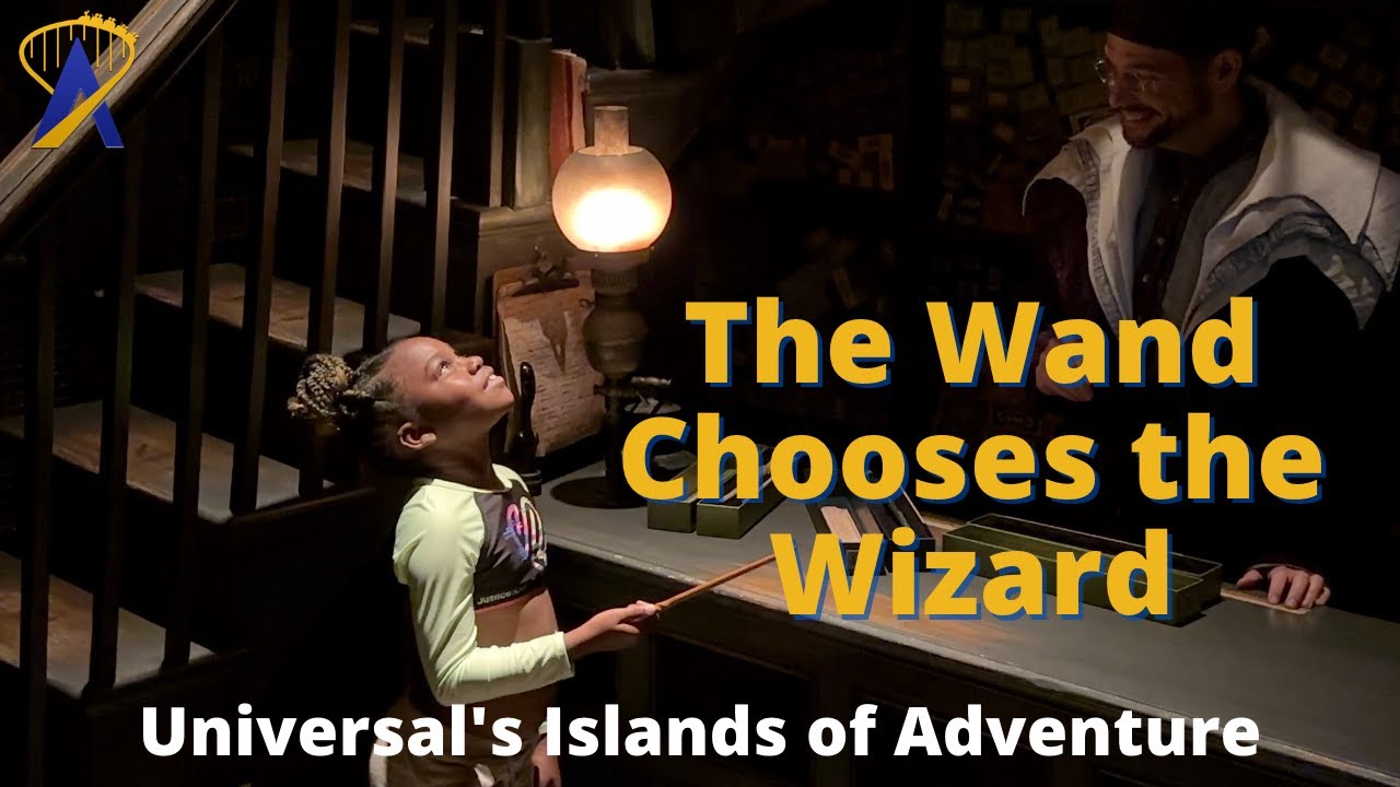 A wand chooses a girl inside Ollivanders Wand Shop in The Wizarding World of Harry Potter Orlando
