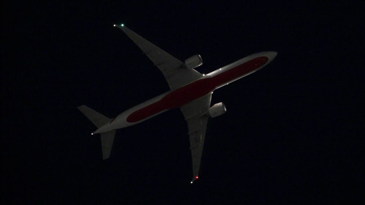 Air India Boeing 777-300ER flying overhead during the night