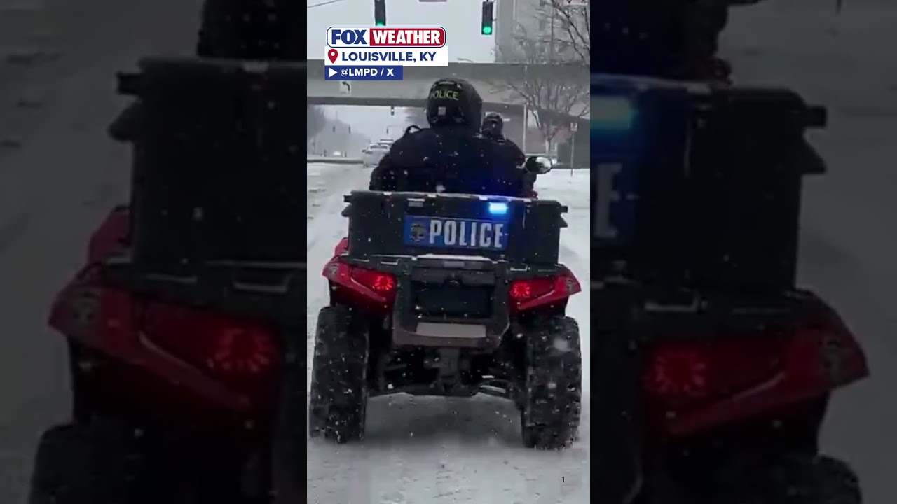 Louisville Police Take A Ride Down Broadway As Heavy Snow Blankets The Region
