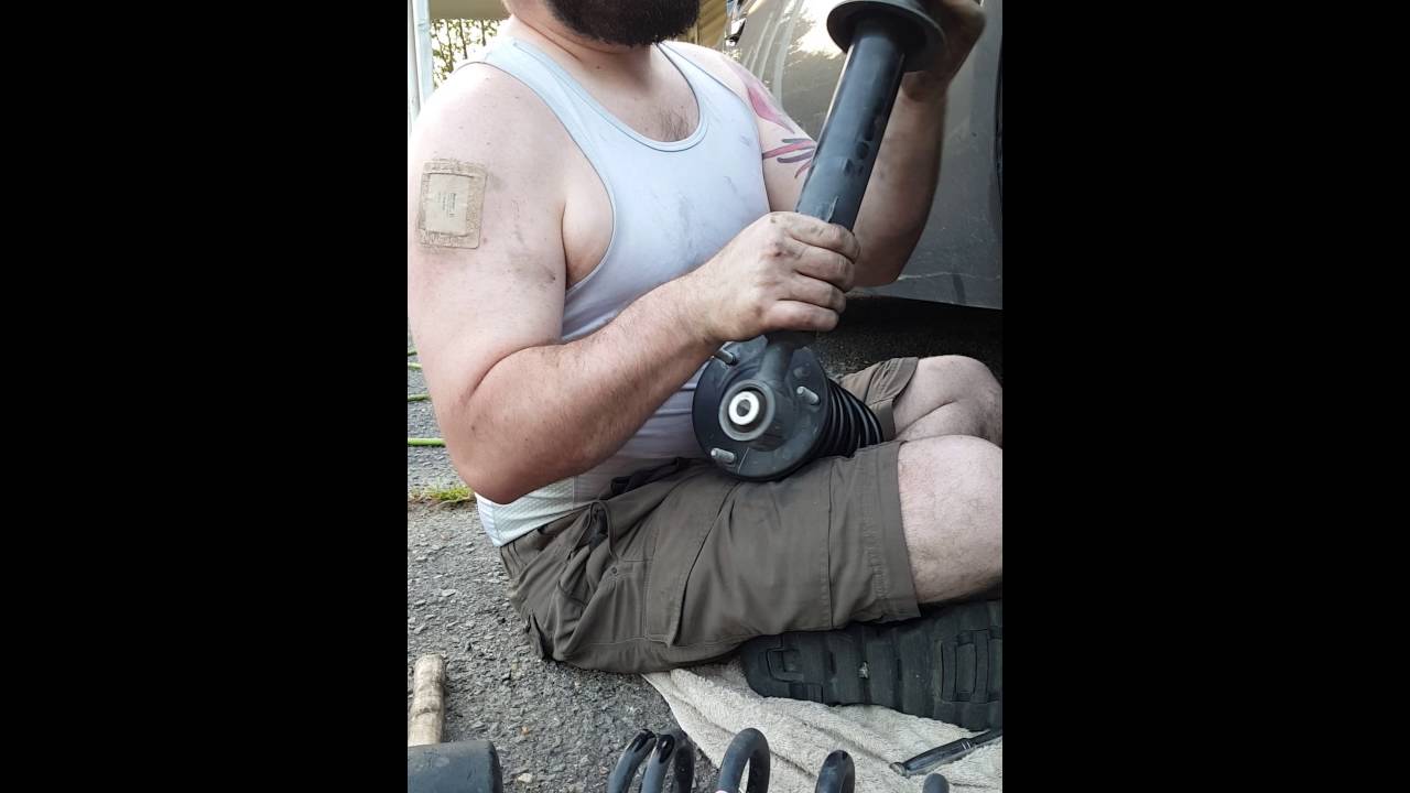 Strut disassembly with no spring compressor.