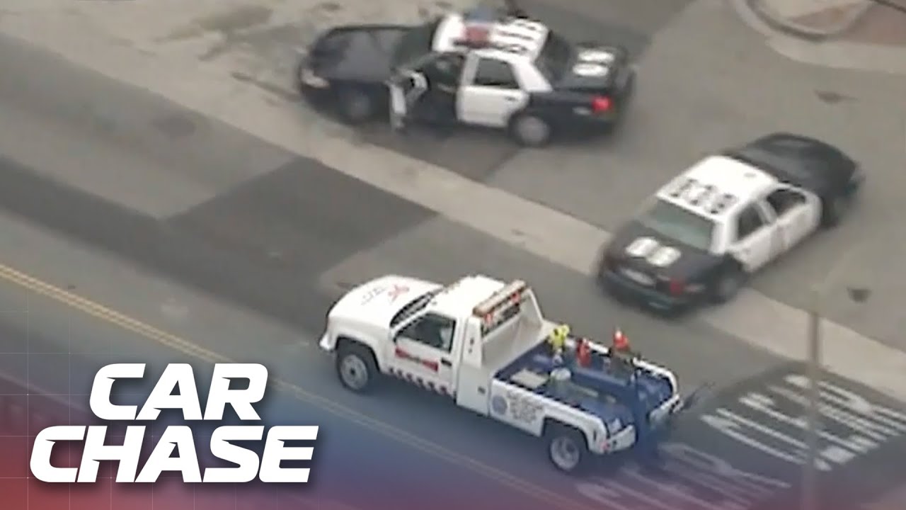 Suspect in Tow Truck attempts to escape the highway patrol
