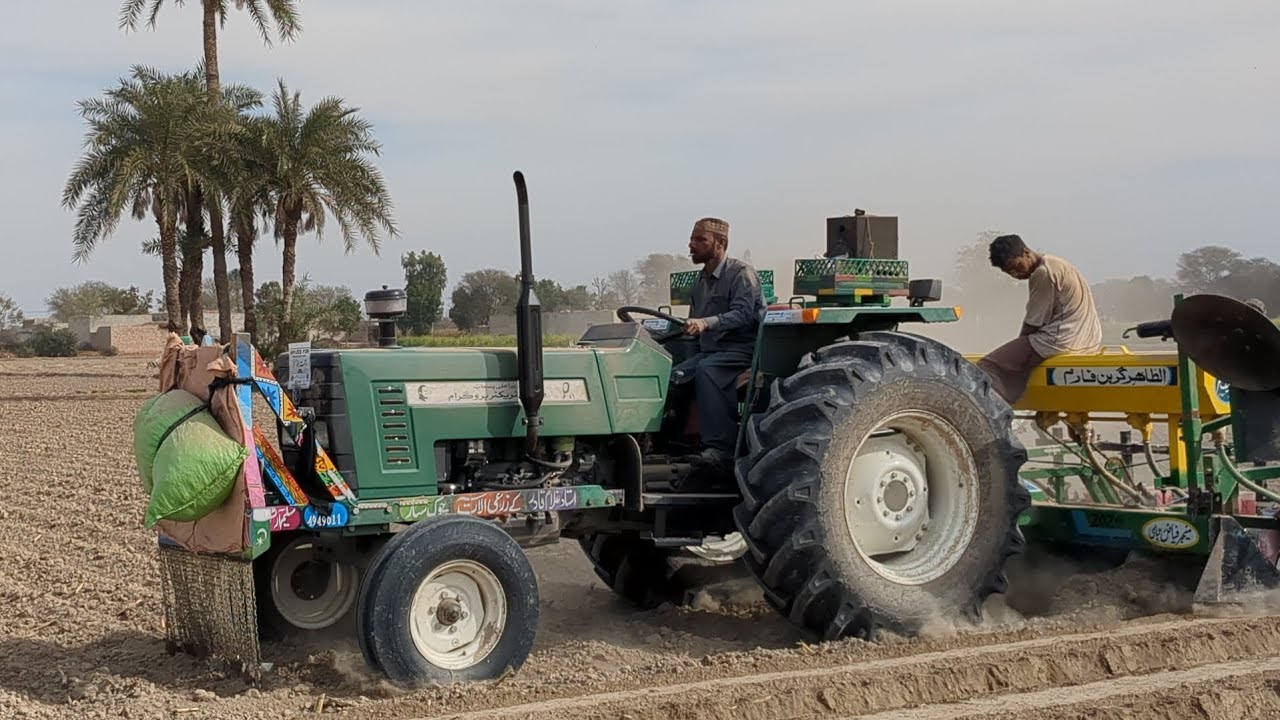 The tractor 🚜 is working on planter 🌽 seed 