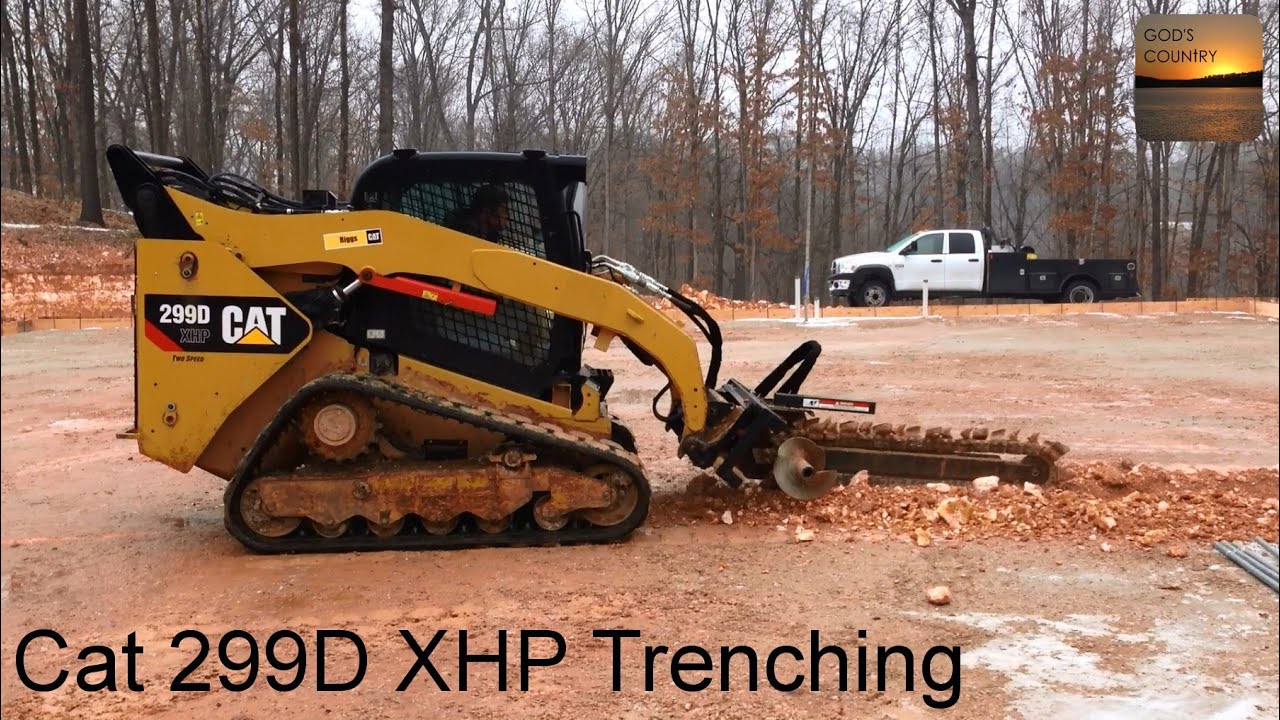 Caterpillar 299D XHP with a Quick Attach High Flow Trencher