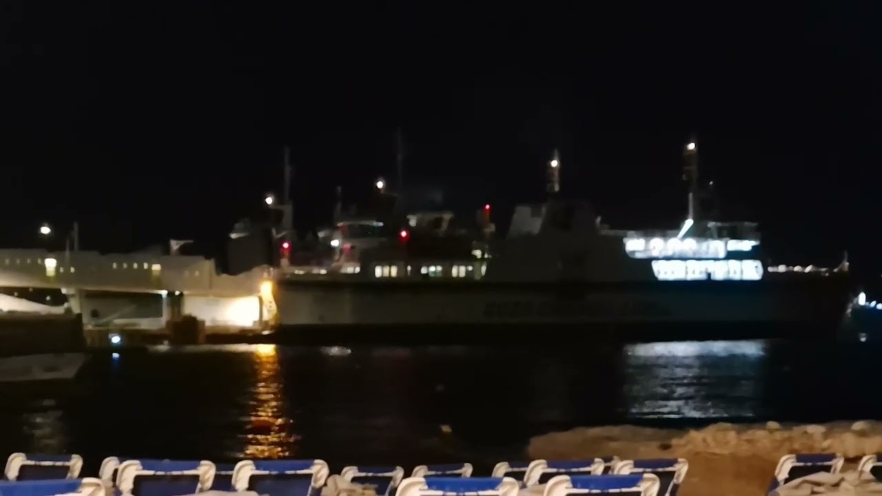 Gozo Channel Line Ferries in Malta docking and undocking at night.