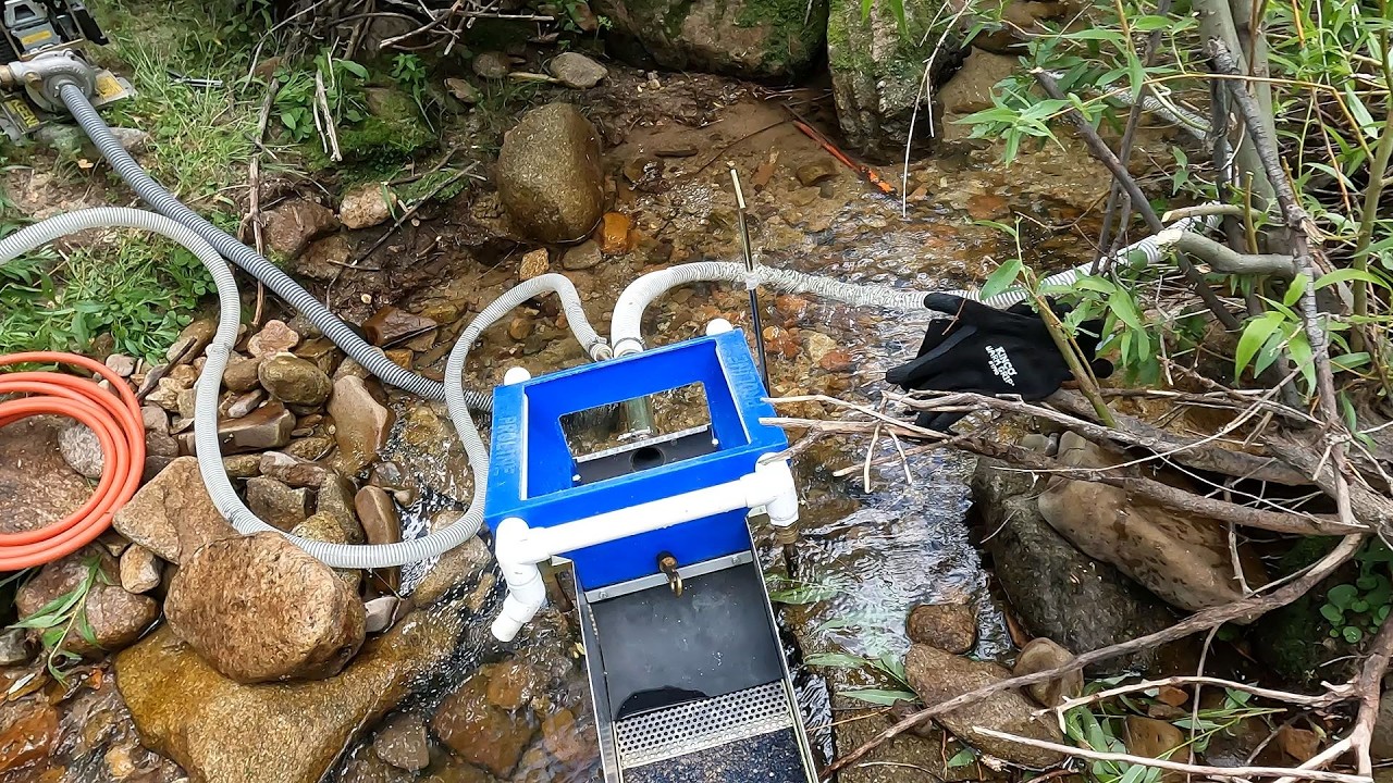 DREDGING FOR GOLD IN A SMALL CREEK