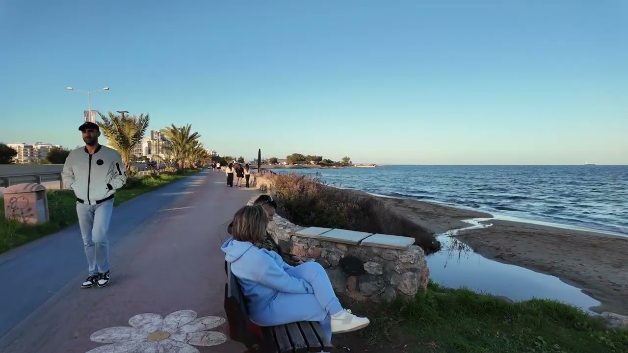 Sunday walk by Iskele Long Beach in Cyprus in winter 