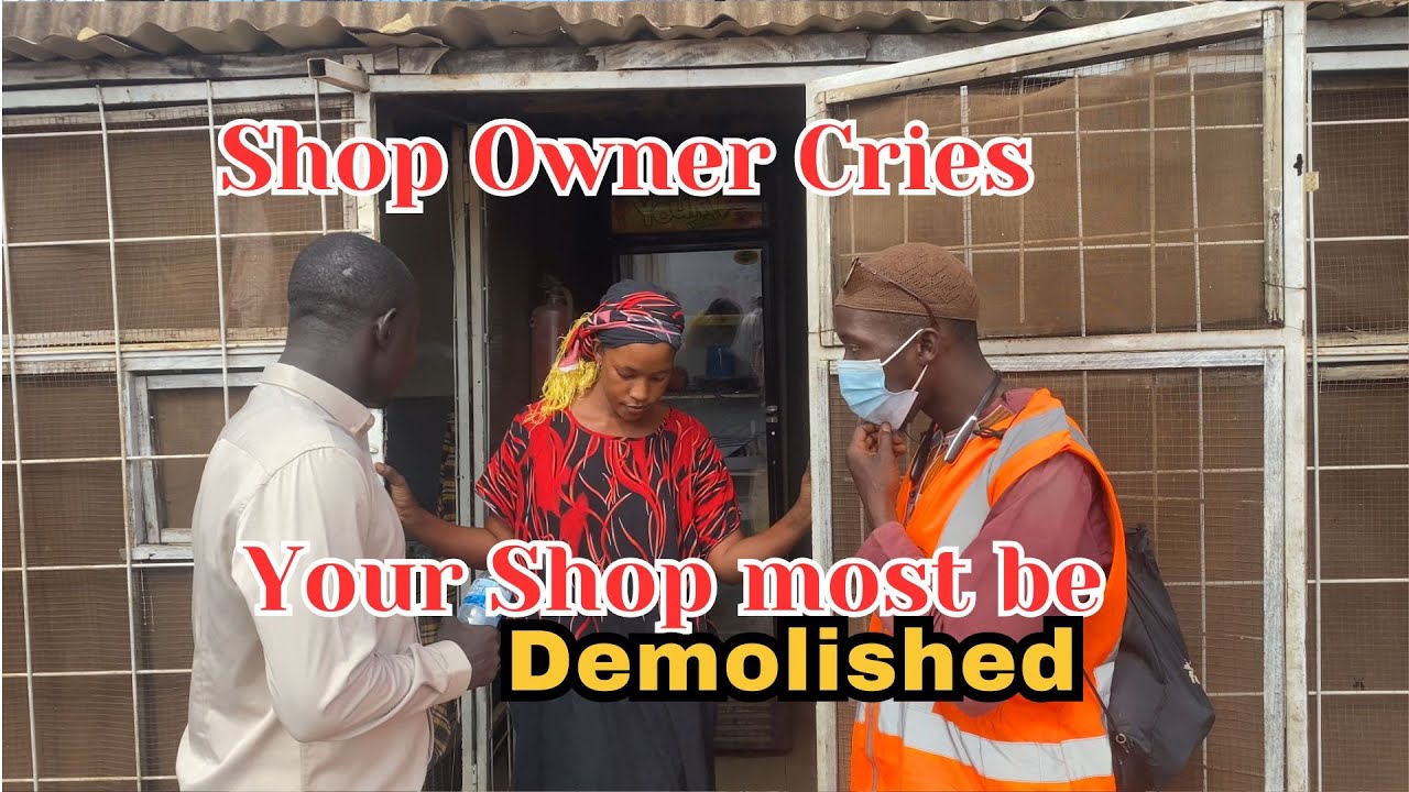 Shop owner cries the demolition of her shop.