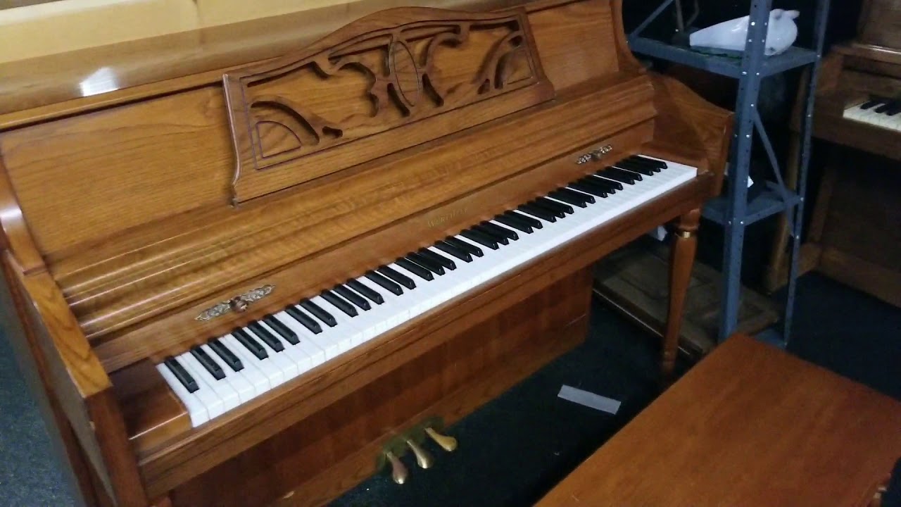 Wurlitzer console piano at Piano Trends Music oak finish