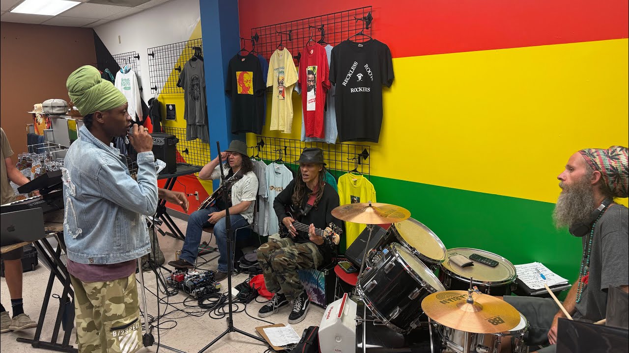 Dre Z Melodi, Teflon Young King, & Young Shanty with Purity Attack Band inside Roots N Culture Shop