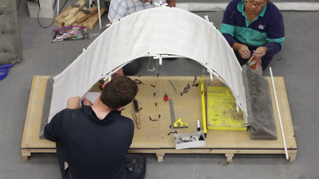 HOW TO BUILD A CONCRETE SHELL OVER A GRIDSHELL