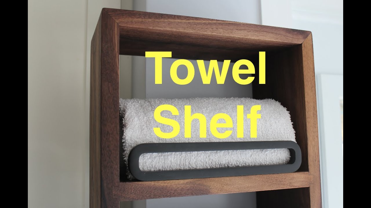 Walnut dovetailed shelving unit.  Towel shelf with mitred corners.
