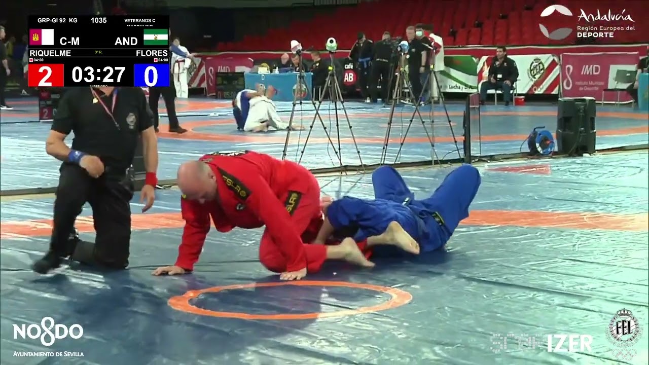 1/2 Final GRAPPLING GI 92Kg: RIQUELME MARTINEZ, JAVIER (C-M) FLORES LOPEZ, ANIBAL (AND)