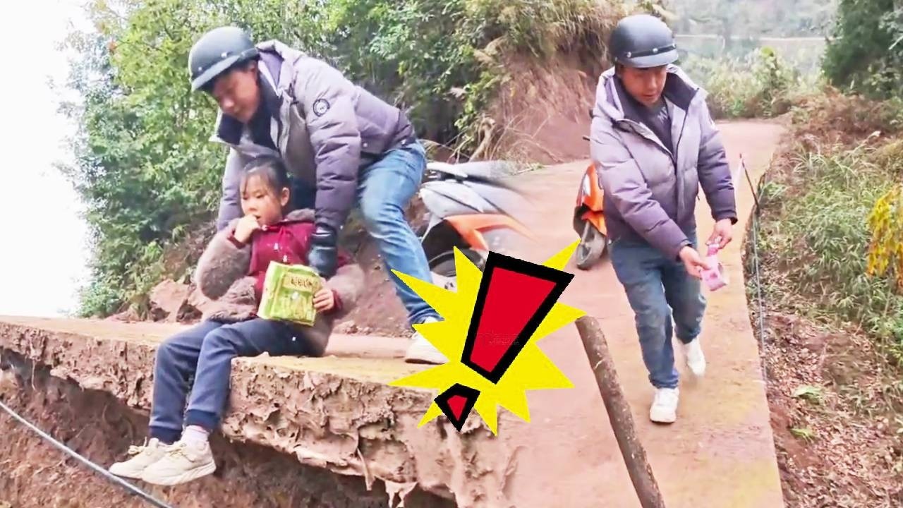 A young girl was rescued by a young man while eating on the edge of a cliff.