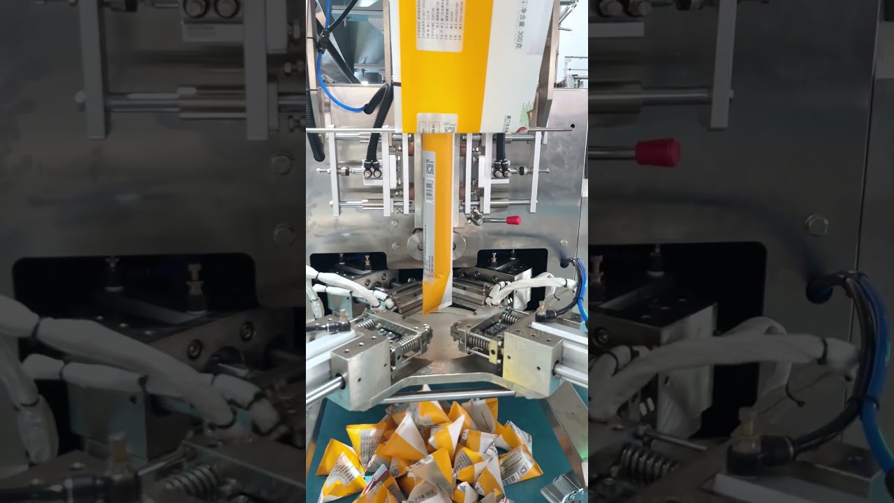 Triangle bag packing machine for candy biscuit nuts small toy #packingmachinemanufacturer