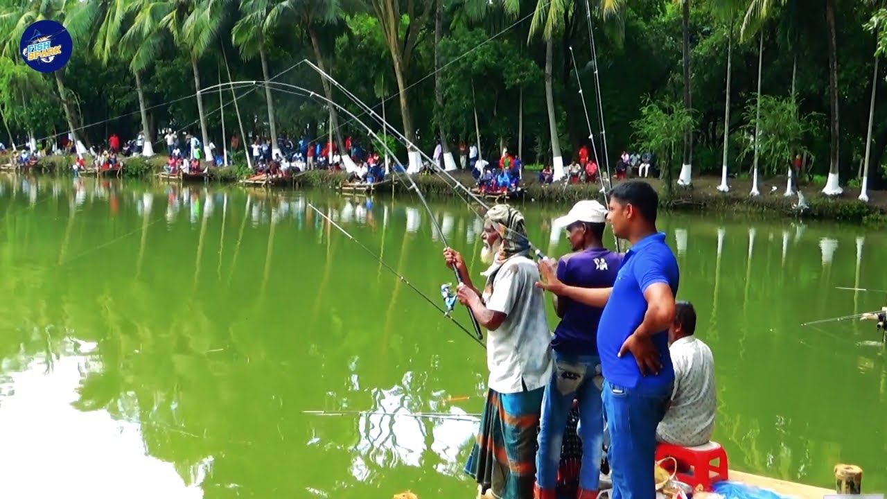 Two Aged Professional Anglers Catching The Big Fish In City Fishing Competition
