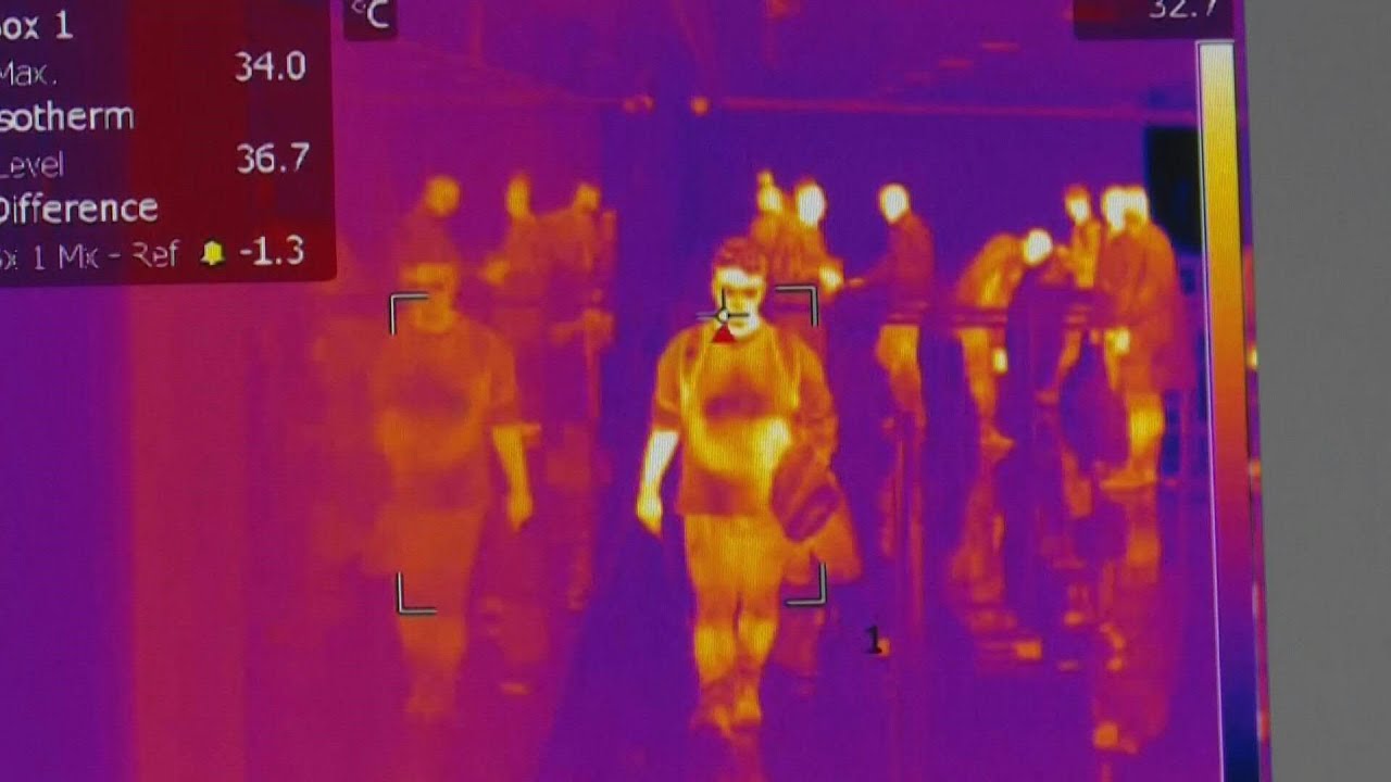 Moroccan health workers scan passengers arriving to airport amid virus fears | AFP