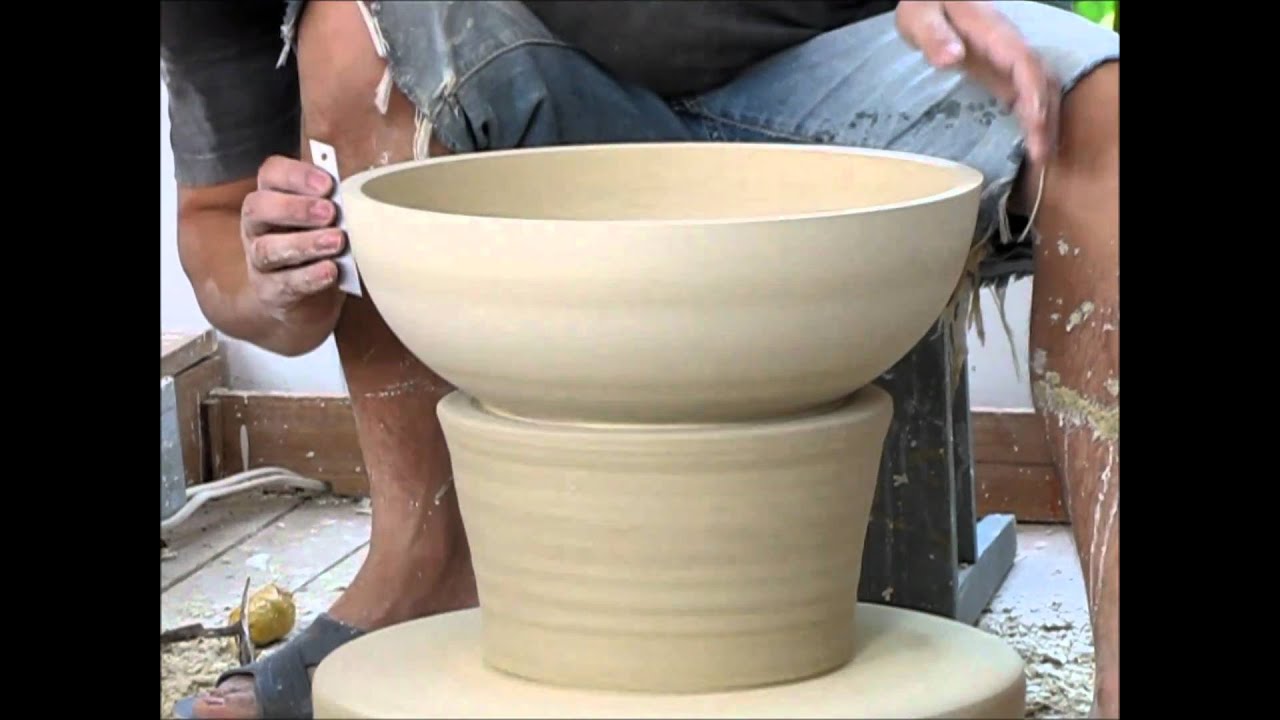 Jingdezhen, China - Trimming Porcelain Pieces