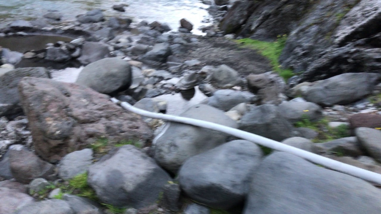 Hidden hot spring behind Seljavallalaug in Iceland
