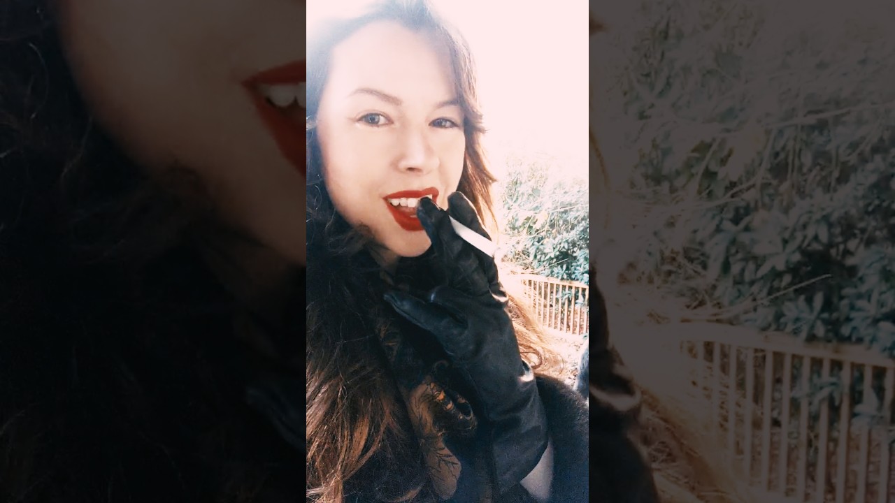 Smoking a Marlboro Red 100 in a fur coat and leather gloves in the fall dusk [VERTICAL | no talking]