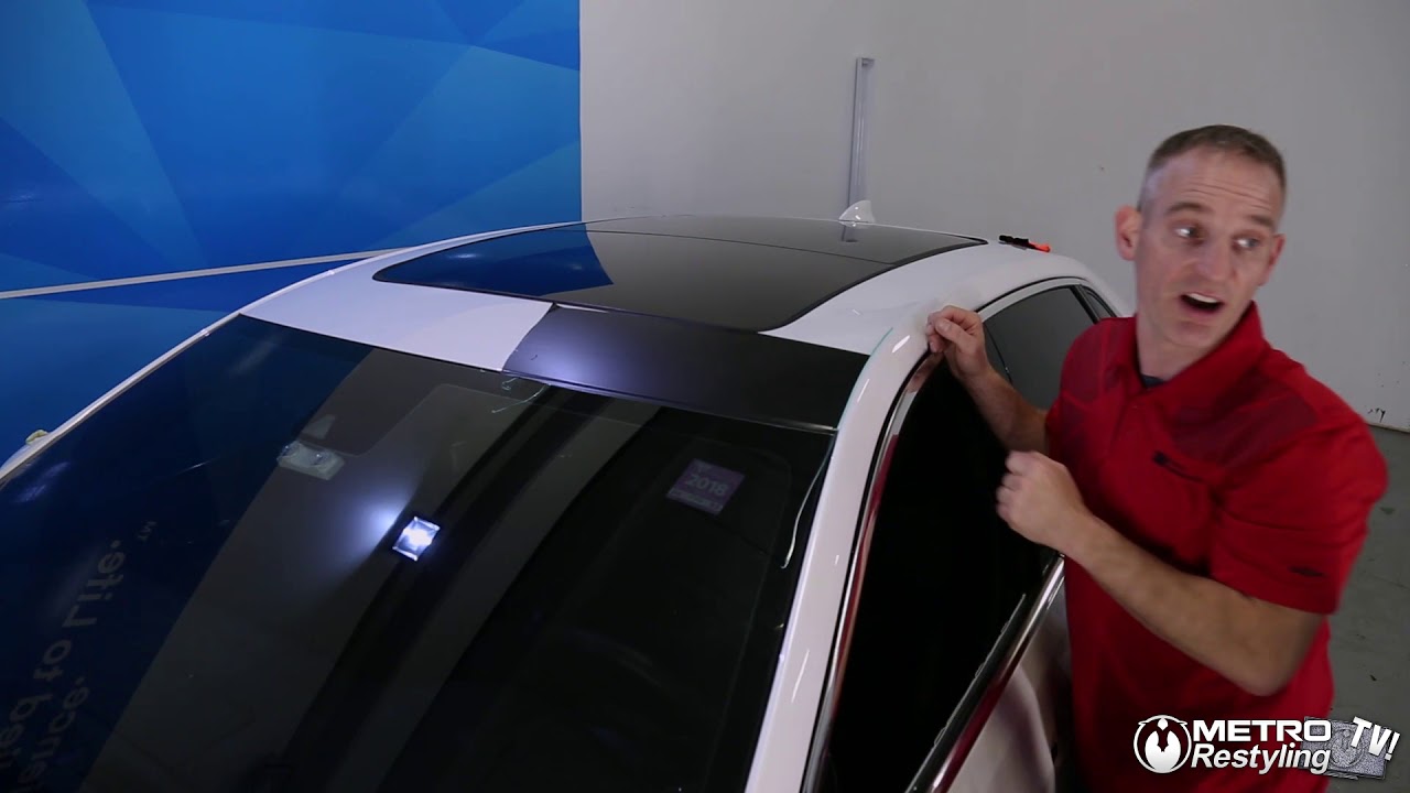 How to tuck vinyl under the car's rubber molding during a roof wrap