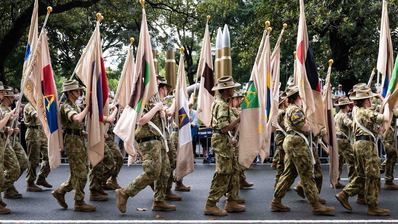 Queensland crowds brave rain for Anzac Day March